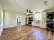 A modern kitchen featuring stainless steel appliances, white cabinets, and a laundry closet at 6440 St Anthony Dr, Hollywood, SC 29449
