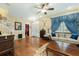Living room features hardwood floors and ornate blue drapes for a sophisticated look at 6440 St Anthony Dr, Hollywood, SC 29449