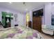 Spacious main bedroom with a large television and natural light at 6440 St Anthony Dr, Hollywood, SC 29449