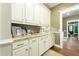 Charming pantry with granite countertop, traditional cabinetry, and stylish hardwood floors at 6440 St Anthony Dr, Hollywood, SC 29449