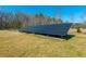 Solar panel array in yard with a fenced area on a sunny day at 6440 St Anthony Dr, Hollywood, SC 29449