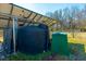 Water collection and storage system with tanks and solar panels outside at 6440 St Anthony Dr, Hollywood, SC 29449