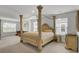 Spacious bedroom featuring a regal four-poster bed and inviting seating area at 648 Chigwell Springs Ln, Summerville, SC 29486