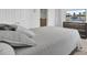 Bedroom features a queen bed with gray bedding, wall mounted tv and dresser at 648 Chigwell Springs Ln, Summerville, SC 29486
