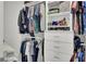 Custom closet with ample storage solutions, including drawers, shelves, and hanging rods for organization at 648 Chigwell Springs Ln, Summerville, SC 29486