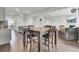 Open-concept with wood floors, dining area, kitchen, and living room at 648 Chigwell Springs Ln, Summerville, SC 29486