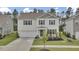 Well-maintained two-story home featuring a landscaped front yard, attached garage, and inviting curb appeal at 648 Chigwell Springs Ln, Summerville, SC 29486