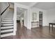 Inviting foyer showcasing hardwood floors, staircase, and open access to the home's living spaces at 648 Chigwell Springs Ln, Summerville, SC 29486