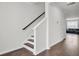 Hardwood stairs in a home with natural light, offering a seamless transition to other rooms at 648 Chigwell Springs Ln, Summerville, SC 29486