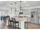 Modern kitchen with stainless appliances and large kitchen island with seating at 648 Chigwell Springs Ln, Summerville, SC 29486