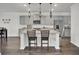 Open-concept kitchen featuring a large island with seating at 648 Chigwell Springs Ln, Summerville, SC 29486