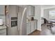 Stainless steel refrigerator and views of kitchen and office area at 648 Chigwell Springs Ln, Summerville, SC 29486