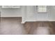 Elegant hardwood flooring in a living space featuring a well-lit door at 648 Chigwell Springs Ln, Summerville, SC 29486
