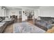 Open-concept living space with hardwood floors, comfortable seating, and seamless access to the kitchen at 648 Chigwell Springs Ln, Summerville, SC 29486