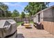 Backyard deck featuring multiple seating areas, a grill, and backyard access at 733 Longfellow Rd, Charleston, SC 29407