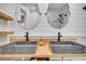 Double vanity bathroom featuring modern sinks, butcher block countertop, and a shiplap wall at 733 Longfellow Rd, Charleston, SC 29407