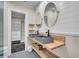 Stylish bathroom with a double vanity, patterned tile floor, and a separate walk-in closet at 733 Longfellow Rd, Charleston, SC 29407