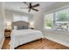 Cozy bedroom with hardwood floors, a ceiling fan, and plenty of natural light at 733 Longfellow Rd, Charleston, SC 29407