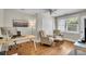 Bright bedroom featuring hardwood floors, a ceiling fan, an area for chairs, and an area with a desk at 733 Longfellow Rd, Charleston, SC 29407