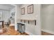 Hallway featuring a built-in floating table that leads to the dining area, with modern decor at 733 Longfellow Rd, Charleston, SC 29407