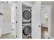 Convenient laundry area with a stacked washer and dryer in a closet near a bathroom at 733 Longfellow Rd, Charleston, SC 29407