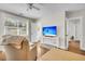 Bright living room featuring hardwood floors, a ceiling fan, and a television on a console table at 733 Longfellow Rd, Charleston, SC 29407