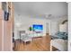 Bright living room featuring hardwood floors, comfortable seating, and a large television for entertainment at 733 Longfellow Rd, Charleston, SC 29407
