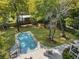 Aerial view of backyard pool with patio, lounge chairs, and lush landscaping at 739 Wildwood Rd, Charleston, SC 29412