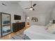 Large bedroom boasting hardwood floors, modern decor and a doorway that leads to the bathroom at 739 Wildwood Rd, Charleston, SC 29412