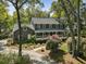 Beautiful two-story home with a covered porch, flagpole, and mature landscaping creating excellent curb appeal at 739 Wildwood Rd, Charleston, SC 29412