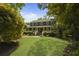 A charming two-story home with a welcoming front porch, surrounded by lush landscaping at 739 Wildwood Rd, Charleston, SC 29412