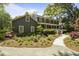 Beautiful two-story home with a covered porch and mature landscaping creating excellent curb appeal at 739 Wildwood Rd, Charleston, SC 29412