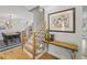 This foyer is decorated with modern décor, wooden floors and stairs at 739 Wildwood Rd, Charleston, SC 29412