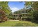 Charming two-story home with a covered front porch and well-manicured lawn and landscaped yard at 739 Wildwood Rd, Charleston, SC 29412