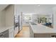 Modern kitchen with stainless steel appliances, a center island with cooktop, and open dining area at 739 Wildwood Rd, Charleston, SC 29412