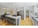 This open-concept kitchen features an island with seating and stainless-steel appliances and lots of storage space at 739 Wildwood Rd, Charleston, SC 29412