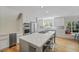 Elegant kitchen with stainless steel appliances, a marble island, and an adjacent breakfast nook at 739 Wildwood Rd, Charleston, SC 29412