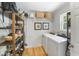 Well-organized laundry room with shelving, baskets, and a front-load washer and dryer at 739 Wildwood Rd, Charleston, SC 29412