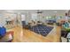 Spacious living room with hardwood floors, a ceiling fan, and abundant natural light at 739 Wildwood Rd, Charleston, SC 29412