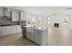 Open concept kitchen featuring an island with a farmhouse sink and stainless steel appliances at 755 Maynard Ln, Summerville, SC 29486