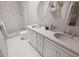 Bright bathroom featuring double sinks, modern faucets, and a walk-in shower at 7621 Indigo Palms Way, Johns Island, SC 29455
