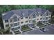 Aerial view of a multi-story condo building with balconies, green shutters, and palm trees at 7621 Indigo Palms Way, Johns Island, SC 29455
