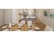 Elegant dining table set in a room featuring a bright kitchen with stainless steel appliances at 7621 Indigo Palms Way, Johns Island, SC 29455