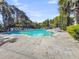 Large community pool with many lounge chairs and patio seating at 7621 Indigo Palms Way, Johns Island, SC 29455