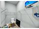 Walk-in closet with shelving and television for organized storage and entertainment at 7621 Indigo Palms Way, Johns Island, SC 29455