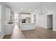 A modern, open kitchen with white cabinets, stainless steel appliances, and an island perfect for cooking at 767 Maynard Ln, Summerville, SC 29486