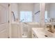 An accessible bathroom featuring a walk-in tub, grab bars, a vanity with ample lighting and convenient towel storage at 777 Hamlet Cir, Goose Creek, SC 29445