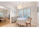 Sunlit breakfast nook featuring a charming round table, cozy seating, and bright window with view of backyard at 777 Hamlet Cir, Goose Creek, SC 29445