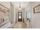 Hallway with wood floors, front door, and a view to the living spaces at 777 Hamlet Cir, Goose Creek, SC 29445