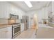 Functional kitchen featuring stainless steel appliances, neutral countertops, and ample cabinet space at 777 Hamlet Cir, Goose Creek, SC 29445